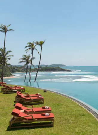 Float in the famous Moon Pool, perched on the cliffside with breathtaking ocean views
